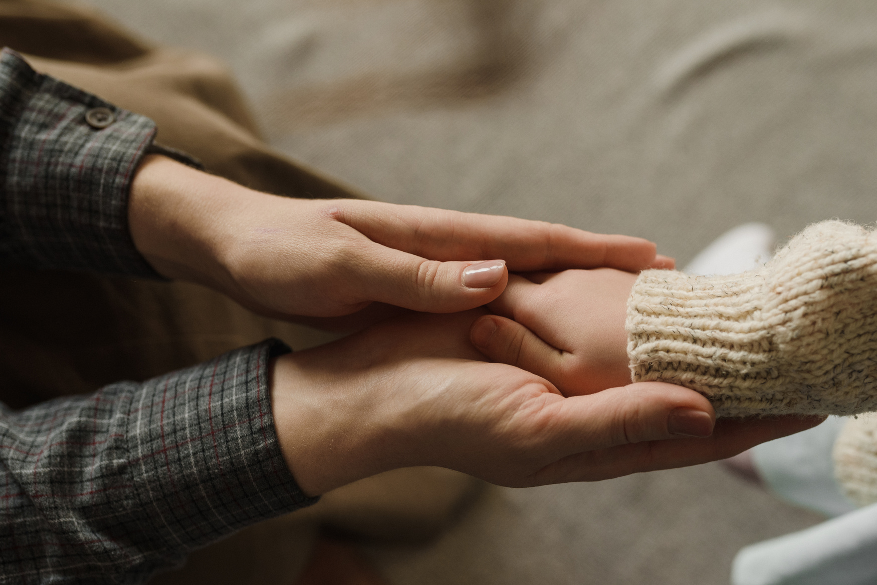 Close-Up Shot of Parent Holding Her Child's Hands